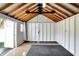 Spacious shed interior with exposed rafters and ample room for storage or hobbies at 51 Wilson Dr, Carmel, IN 46032