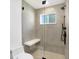 Modern shower features glass doors, gray tiled walls, a fixed shower head and a built in bench at 51 Wilson Dr, Carmel, IN 46032