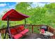 Deck with a swing, table, grill, and a view of the backyard at 5348 Pelham Way, Indianapolis, IN 46216