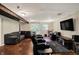 Finished basement featuring two couches, theatre seating, and flat screen TV at 5348 Pelham Way, Indianapolis, IN 46216