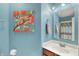 Bright bathroom with a vanity, owl art, towel rack and a mirror with recessed lighting at 5348 Pelham Way, Indianapolis, IN 46216