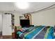 Bedroom with a bed, shelving, TV, and a door to another room at 5348 Pelham Way, Indianapolis, IN 46216