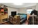Bedroom featuring shelving, TV, small closet, and a window at 5348 Pelham Way, Indianapolis, IN 46216