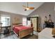 Bedroom features a ceiling fan and natural light from multiple windows at 5348 Pelham Way, Indianapolis, IN 46216