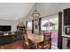 View of dining area featuring an open-concept design with natural light and view of living room at 5348 Pelham Way, Indianapolis, IN 46216