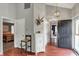 Spacious foyer with hardwood floors, decorative lighting, and ample closet space at 5348 Pelham Way, Indianapolis, IN 46216