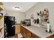 Galley style kitchen with countertop, storage, and stainless steel sink at 5348 Pelham Way, Indianapolis, IN 46216