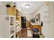 Galley kitchen with shelving, black refrigerator, and stainless steel appliances at 5348 Pelham Way, Indianapolis, IN 46216