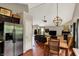 Open floor plan flows from kitchen to dining and living area with fireplace at 5348 Pelham Way, Indianapolis, IN 46216