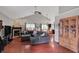 Open-concept living room with hardwood floors, fireplace, and vaulted ceilings at 5348 Pelham Way, Indianapolis, IN 46216