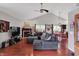Bright living room featuring a vaulted ceiling, a fireplace, and hardwood flooring at 5348 Pelham Way, Indianapolis, IN 46216