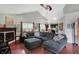 Spacious living room with hardwood floors, vaulted ceiling, fireplace, and backyard views at 5348 Pelham Way, Indianapolis, IN 46216