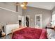 Bedroom includes a ceiling fan, ensuite bath, and walk-in closet at 5348 Pelham Way, Indianapolis, IN 46216