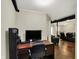 Office area with a desk, computer, and comfortable seating in a finished basement space at 5348 Pelham Way, Indianapolis, IN 46216
