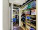 Basement storage room with shelving and storage, offering practical organizational space at 5348 Pelham Way, Indianapolis, IN 46216
