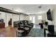 Spacious entertainment room equipped with theater-style seating and a large television screen at 5348 Pelham Way, Indianapolis, IN 46216