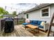 Inviting back deck with comfortable seating, outdoor lighting, and a grill, creating a perfect spot for entertaining at 5643 Rosslyn Ave, Indianapolis, IN 46220