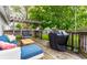 A lovely back deck with a cozy sofa, egg chair, pergola, and grill, perfect for outdoor relaxation and entertainment at 5643 Rosslyn Ave, Indianapolis, IN 46220