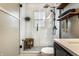 Updated bathroom with a glass shower, modern fixtures, and natural wood accents at 5643 Rosslyn Ave, Indianapolis, IN 46220