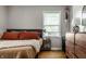 Bedroom with hardwood floors, natural light and modern decor at 5643 Rosslyn Ave, Indianapolis, IN 46220