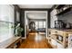 Entryway with hardwood flooring, modern accents and view into living room at 5643 Rosslyn Ave, Indianapolis, IN 46220