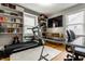 Bright exercise room with large shelving and a treadmill, creating a great space for a workout area at 5643 Rosslyn Ave, Indianapolis, IN 46220