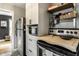 Kitchen features stainless steel refrigerator and oven with butcher block countertop and microwave at 5643 Rosslyn Ave, Indianapolis, IN 46220