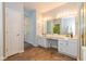 Bathroom with double vanity sinks, ample cabinet space, and a large mirror with lighting at 5744 Spruce Knoll Ct, Indianapolis, IN 46220
