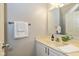 Clean, white bathroom with a single vanity, neutral walls, and coordinated towel rack at 5744 Spruce Knoll Ct, Indianapolis, IN 46220