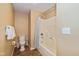 Bathroom featuring a tub and shower combination, toilet, and neutral finishes at 5744 Spruce Knoll Ct, Indianapolis, IN 46220