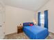 Bedroom featuring neutral walls, carpet, window, and blue accents at 5744 Spruce Knoll Ct, Indianapolis, IN 46220