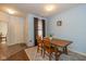 Cozy dining area features a wood table and chairs, with natural light from a nearby window at 5744 Spruce Knoll Ct, Indianapolis, IN 46220