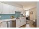 Bright kitchen featuring white cabinetry, stainless steel appliances, and attractive backsplash at 5744 Spruce Knoll Ct, Indianapolis, IN 46220