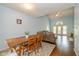 View of the living room featuring hardwood floors and a dining area with a wood table and chairs at 5744 Spruce Knoll Ct, Indianapolis, IN 46220