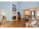 Inviting living room features high ceilings, a fireplace, hardwood floors, and comfortable leather seating at 5744 Spruce Knoll Ct, Indianapolis, IN 46220