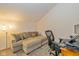 Cozy seating area with a sectional sofa, ottoman, and desk space at 5744 Spruce Knoll Ct, Indianapolis, IN 46220