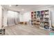 Finished basement with vinyl flooring, recessed lights and ample shelving at 5829 Broadway St, Indianapolis, IN 46220
