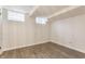 Unfinished basement featuring vinyl flooring and a partially finished ceiling at 5829 Broadway St, Indianapolis, IN 46220
