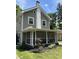 Charming home featuring a screened front porch, light-colored siding and white trim at 5829 Broadway St, Indianapolis, IN 46220