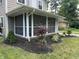 Lovely screened porch with ample seating, perfect for enjoying the outdoors at 5829 Broadway St, Indianapolis, IN 46220