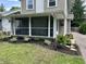 Lovely screened porch with ample seating, perfect for enjoying the outdoors at 5829 Broadway St, Indianapolis, IN 46220