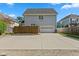 Backyard showcasing a parking space, garage and wooden fence at 608 East 21St St, Indianapolis, IN 46202