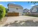 Backyard displaying a garage, parking space, and wooden fence at 608 East 21St St, Indianapolis, IN 46202