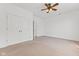 Bedroom boasts a window with natural light, neutral carpet, ceiling fan and double closet at 608 East 21St St, Indianapolis, IN 46202