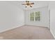 Bedroom featuring neutral carpet, a ceiling fan, and a view of the backyard at 608 East 21St St, Indianapolis, IN 46202