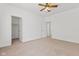 Bedroom boasting neutral carpet, ceiling fan, and multiple entryways at 608 East 21St St, Indianapolis, IN 46202