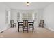 Bright dining room with large windows and ample seating for formal gatherings at 608 East 21St St, Indianapolis, IN 46202