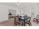 Bright dining room featuring a dark wood table with seating and light-filled windows at 608 East 21St St, Indianapolis, IN 46202