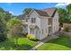 Charming two-story home featuring a well-manicured lawn and attractive stone walkway at 608 East 21St St, Indianapolis, IN 46202