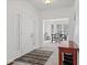 Bright foyer with tile flooring, white double doors, and views into the dining room at 608 East 21St St, Indianapolis, IN 46202
